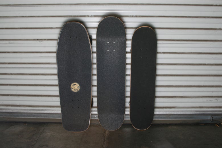 Cruiser, standard, and soft top complete skateboards next to each other.