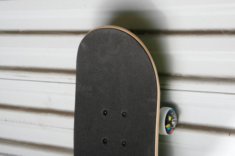 A soft-top pre-built complete skateboard.