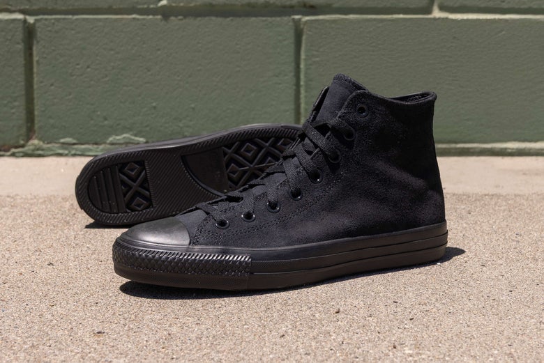 All black Converse CTAS Shoes, displayed outdoors.